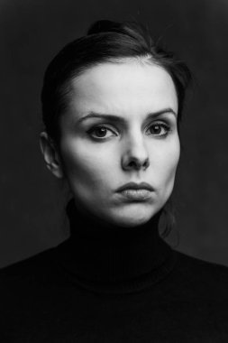 emotional girl in a black turtleneck 