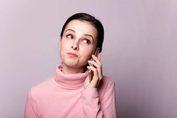 Beautiful Girl Pink Turtleneck Talking Phone Gray Background — Stock Photo, Image