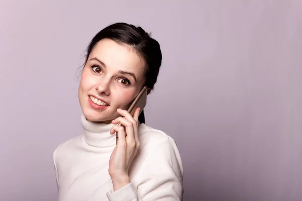 Girl White Turtleneck Talking Phone Portrait Gray Background — Stock Photo, Image