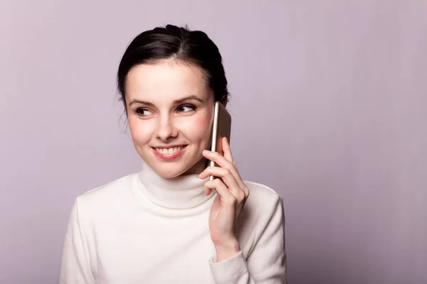 Girl White Turtleneck Talking Phone Portrait Gray Background — Stock Photo, Image