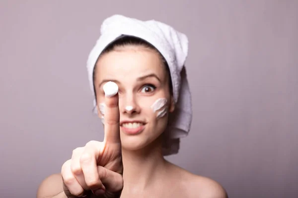 Girl White Towel Her Head Cream Her Face Hand Gray — Stock Photo, Image