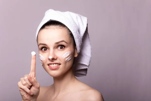Girl White Towel Her Head Cream Her Face Hand Gray — Stock Photo, Image