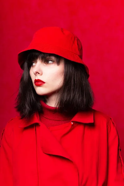girl in red clothes, red background
