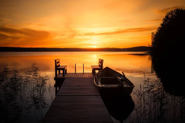 Sunset over the fishing pier at the lake in Finland — Stock Photo, Image