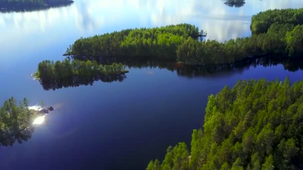 Aerial shot of beautiful islands at lake on a calm summer day. — Stock Video