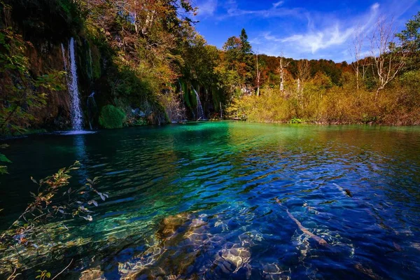 Waterfalls in national park falling into turquoise lake. Plitvice Croatia