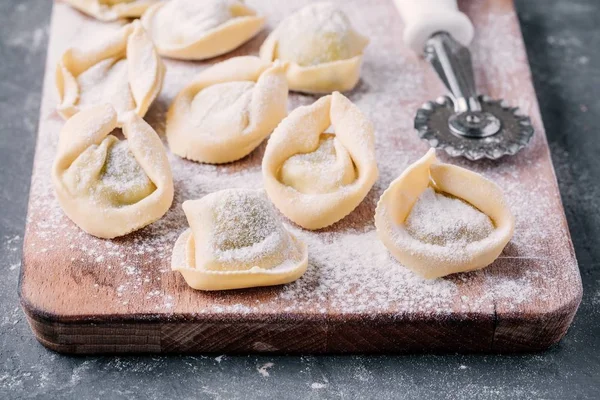 Fresh raw homemade tortellini or ravioli pasta closeup — Stock Photo, Image