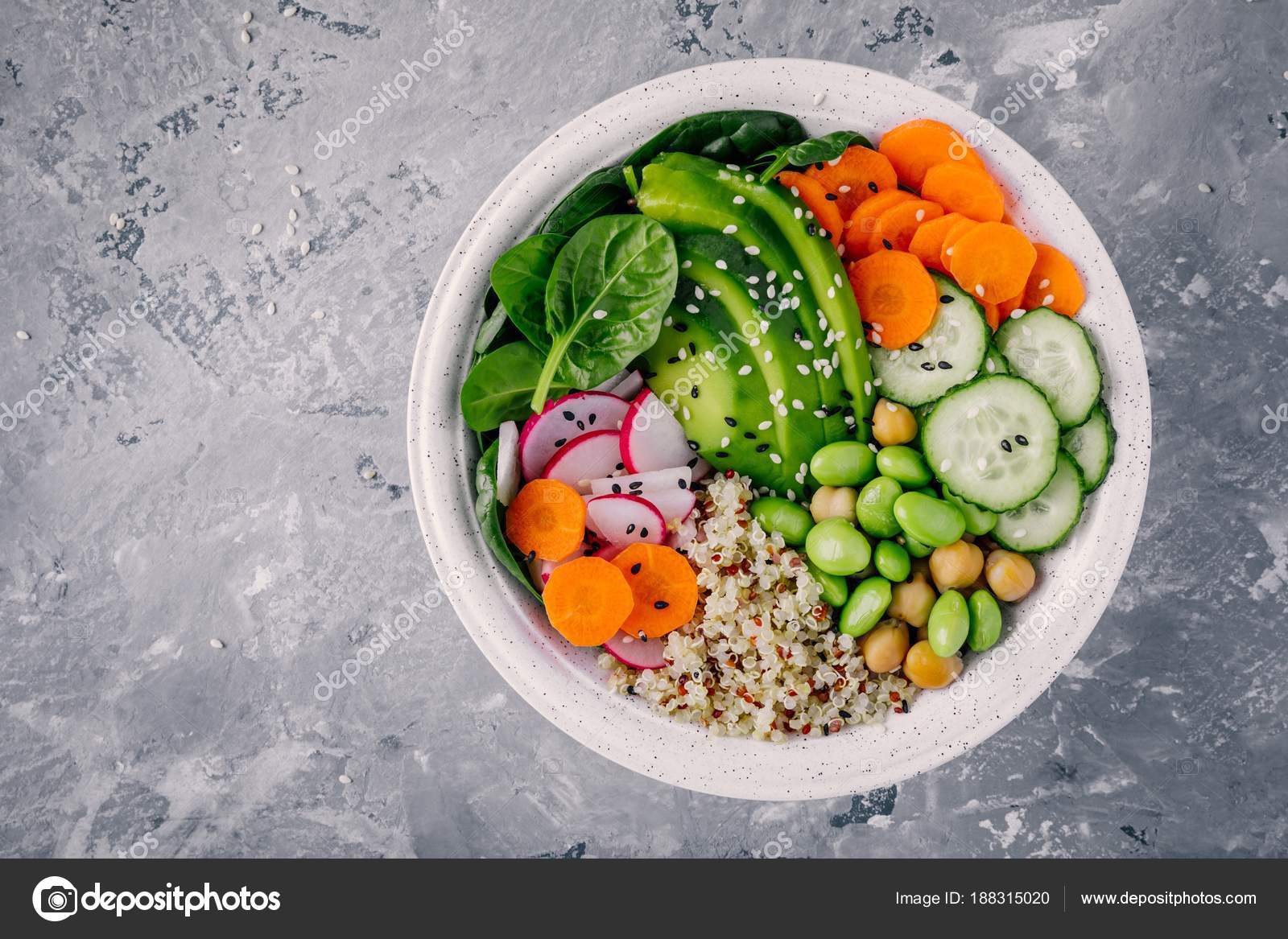 Vegan Buddha bowl salad with spinach, quinoa, roasted chickpeas