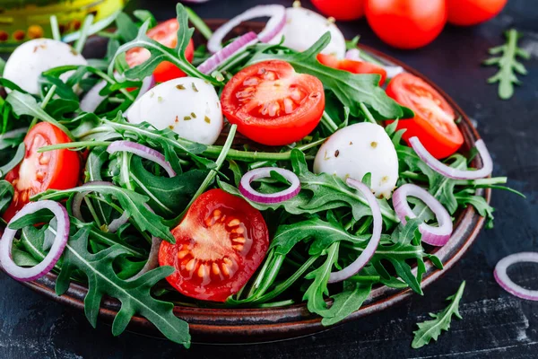 Arugula Mozzarella Salad Tomatoes Red Onions Dark Background — Stock Photo, Image