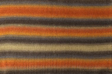 Örülmüş doku. Yünden desenli kumaş. Arka plan, kopyalama alanı. El yapımı süveter deseni, yün örgü deseni