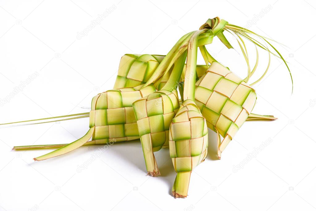 Ketupat isolated on white background. a typical dish made from rice wrapped in wrappers made from plaited young coconut leaves.