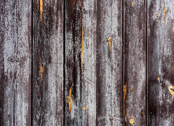 Tábuas de madeira velhas estão posicionadas verticalmente. fundo de madeira cinza vintage com veias laranja — Fotografia de Stock