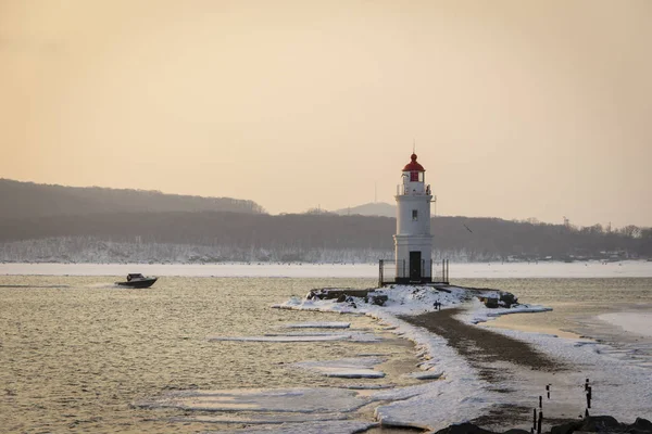 Tokarevsky lighthouse in Vladivostok at dawn on a winter morning.