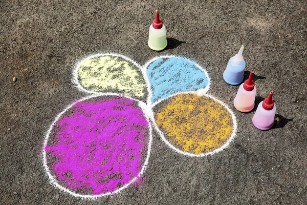 Colorful sand painting on ground