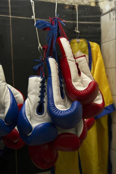 Boxing Gloves hanging on storage room