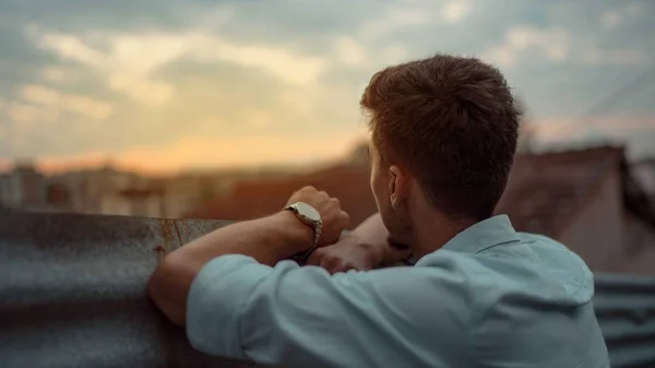 Young business man and entrepreneur, looking at the city view towards the horizon.