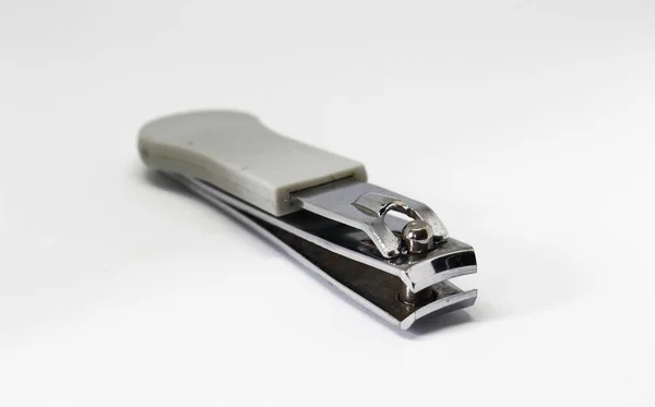 Белый нож для ногтей изолирован на белом фоне — стоковое фото