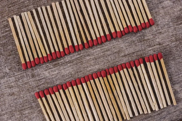 Pile of matchsticks arrange in a row — Stock Photo, Image