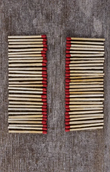 Pile of matchsticks arrange in a row — Stock Photo, Image