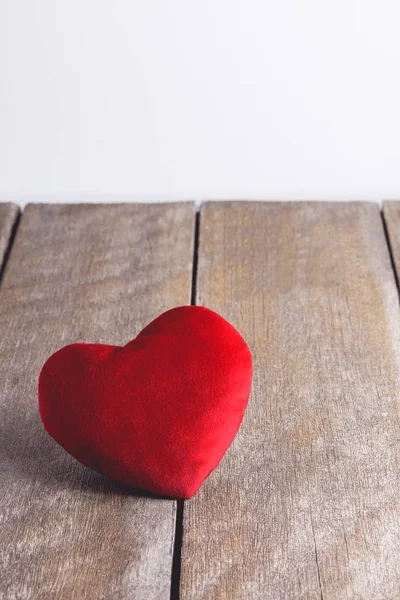 Red Heart Shape pillows on wooden background — Stock Photo, Image