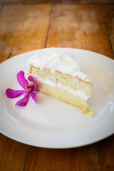 Coconut cake on white plate — Stock Photo, Image