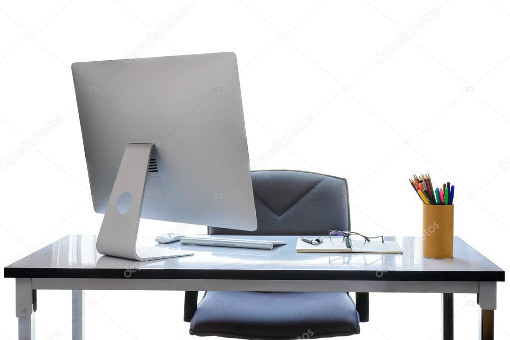 Office desk with desktop computer, cup of coffee and office equi
