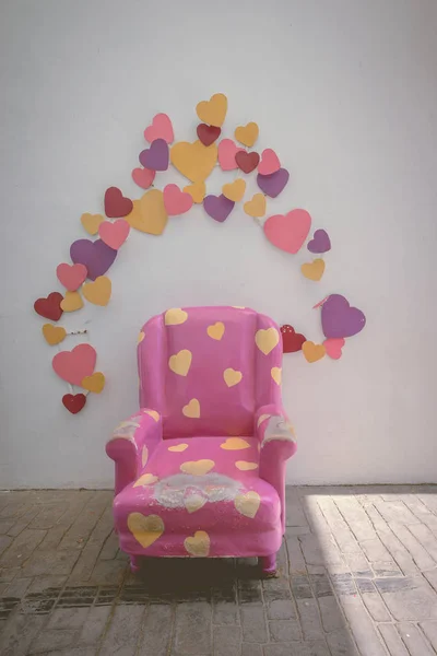 Purple vintage chair with colorful heart decoration — Stock Photo, Image