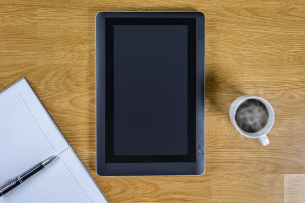 Mans working place at wooden desktop with coffee — Stock Photo, Image