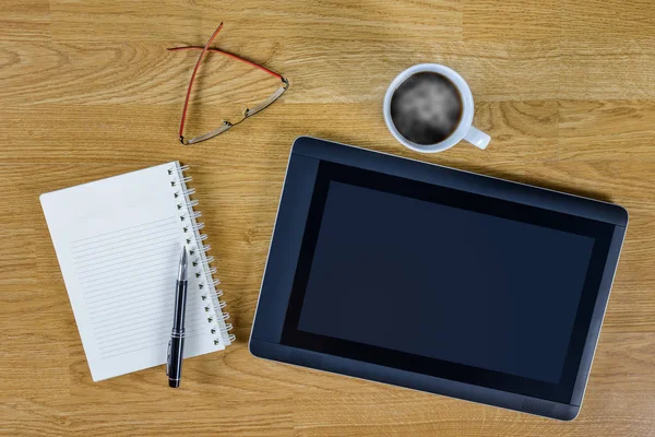 Mans working place at wooden desktop with coffee — Stock Photo, Image