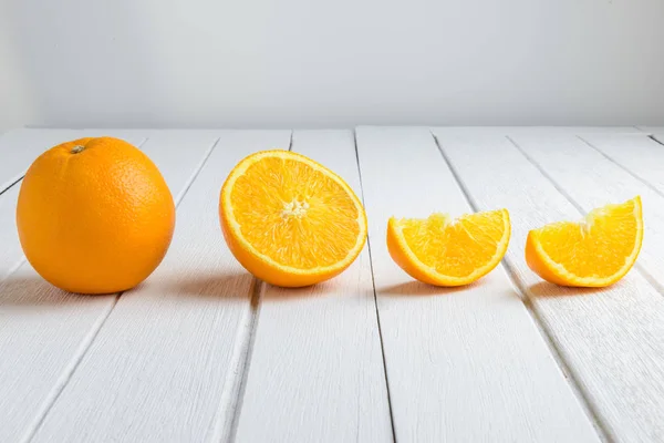Still Life Half crescent, Half, Full Fresh Orange Fruit on Vinta — Stock Photo, Image