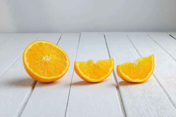 Still Life Half crescent, Half Fresh Orange Fruit on Vintage Whi — Stock Photo, Image