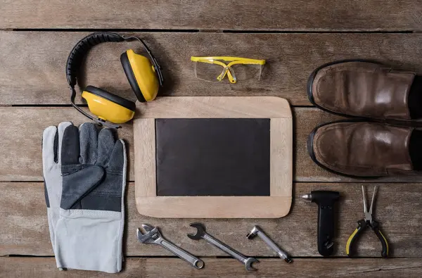 Standard construction safety equipment on wooden table. top view — Stock Photo, Image