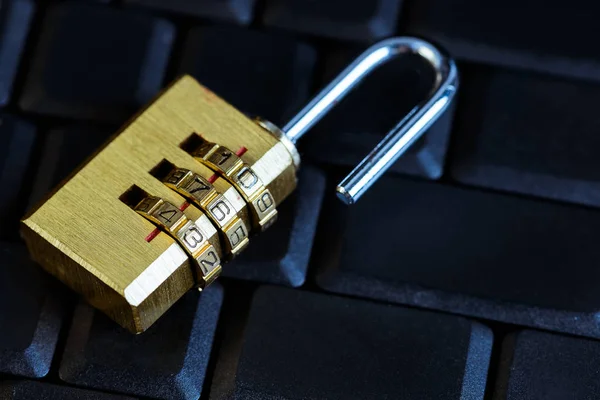 Metal security lock with password on computer keyboard — Stock Photo, Image