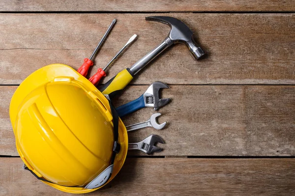 Standard construction safety equipment and tools set on wooden t — Stock Photo, Image