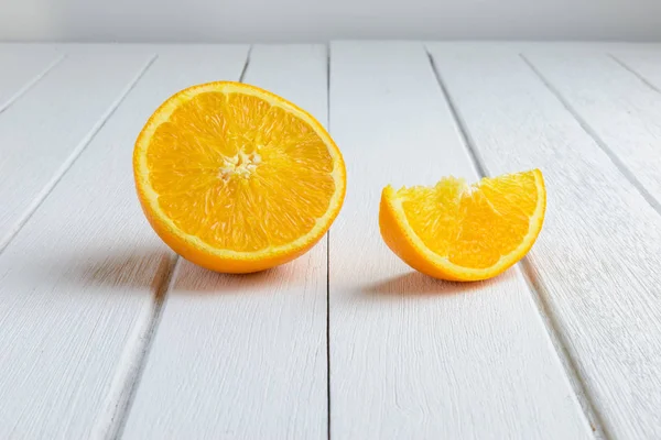 Still Life Half crescent, Half Fresh Orange Fruit on Vintage Whi — Stock Photo, Image