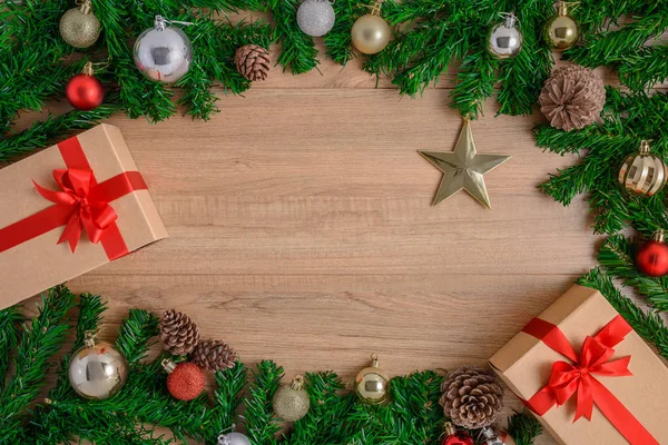 Christmas fir tree with decoration on wooden board — Stock Photo, Image