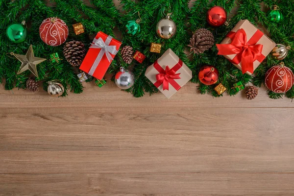 Christmas fir tree with decoration on wooden board — Stock Photo, Image