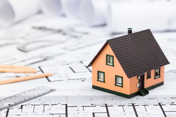 Construction plans with drawing tools and House Miniature on blu — Stock Photo, Image