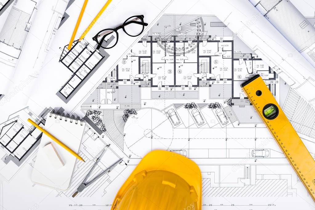 Construction plans with drawing and working Tools on blueprints