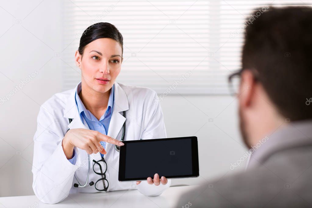 Female doctor explaining something to a patient 