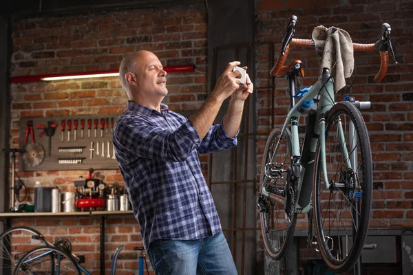 Mechanic or rider photographing a bicycle