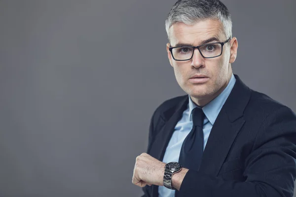 Irate Manager Boss Glaring Latecomer Meeting Holding His Wristwatch Stern — Stock Photo, Image