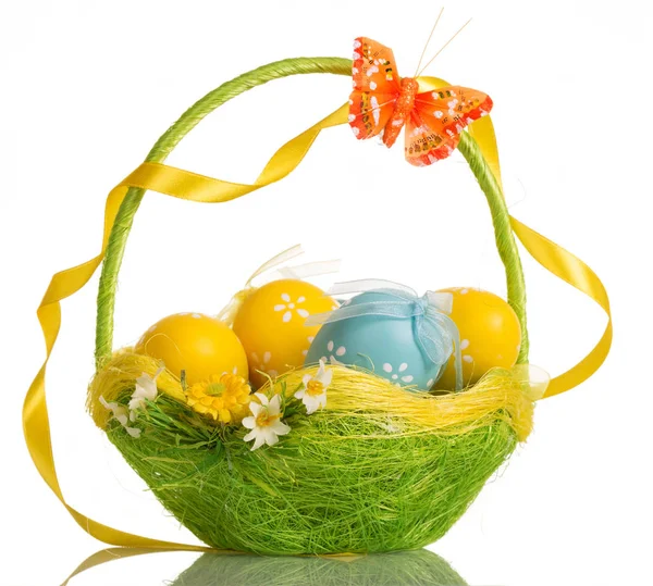 Basket with easter eggs, butterfly and ribbon on handle, isolated. — Stock Photo, Image