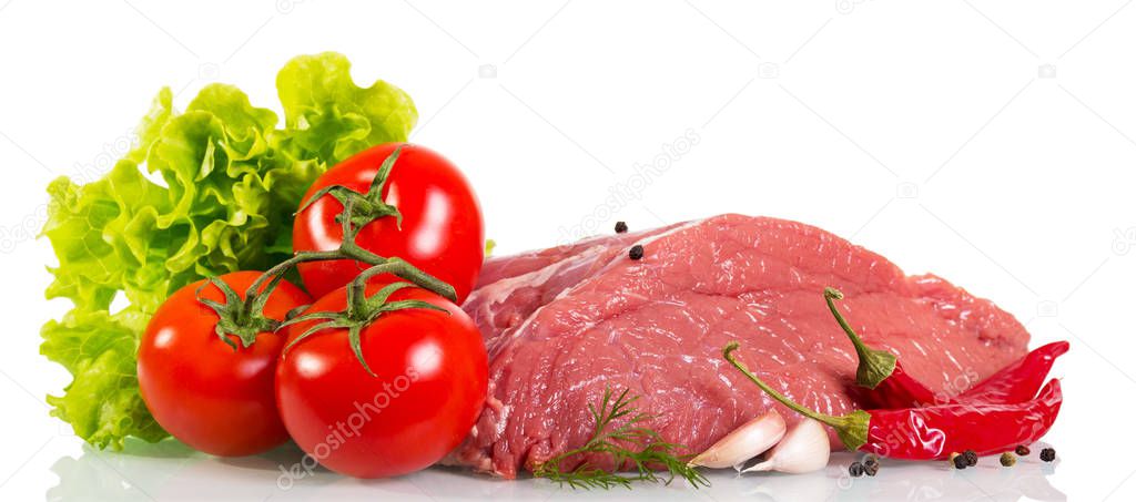 Piece of raw beef, tomato, mushrooms, lettuce, dill, garlic