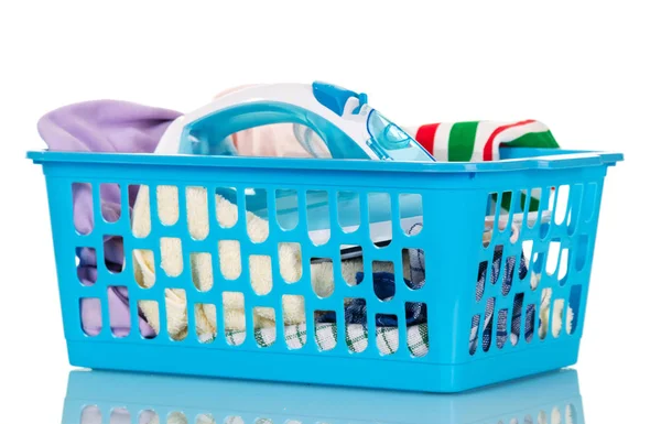 Basket with linen and iron on white — Stock Photo, Image