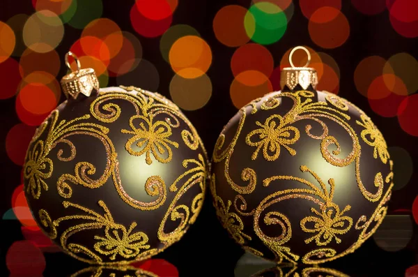 Beautiful Christmas balls with a pattern on flickering backgroun — Stock Photo, Image