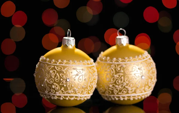 Beautiful Christmas beige balls on flickering background — Stock Photo, Image