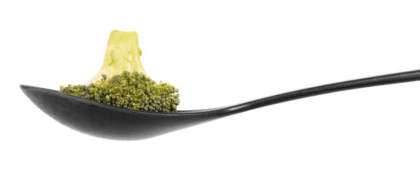 Ripe inflorescence of broccoli in spoon close-up isolated — 스톡 사진