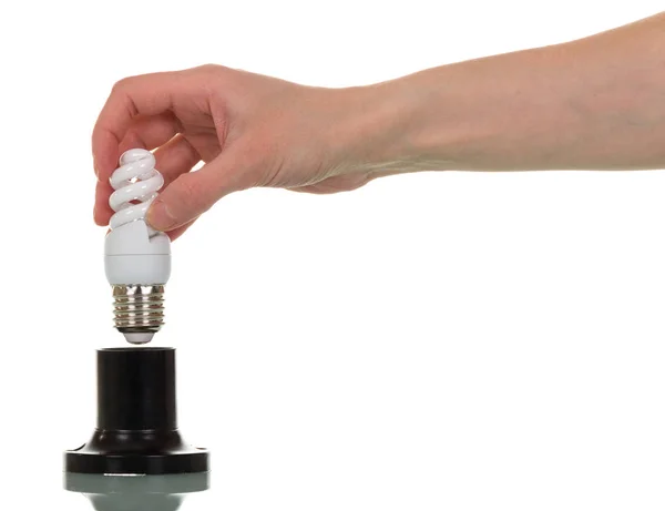 Na mão feminina lâmpada fluorescente compacta, o cartucho — Fotografia de Stock