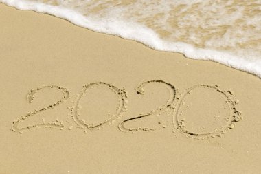 2020 inscription on sand